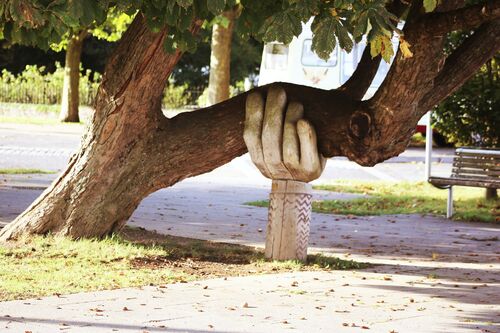 Tree with hand sculpture support
